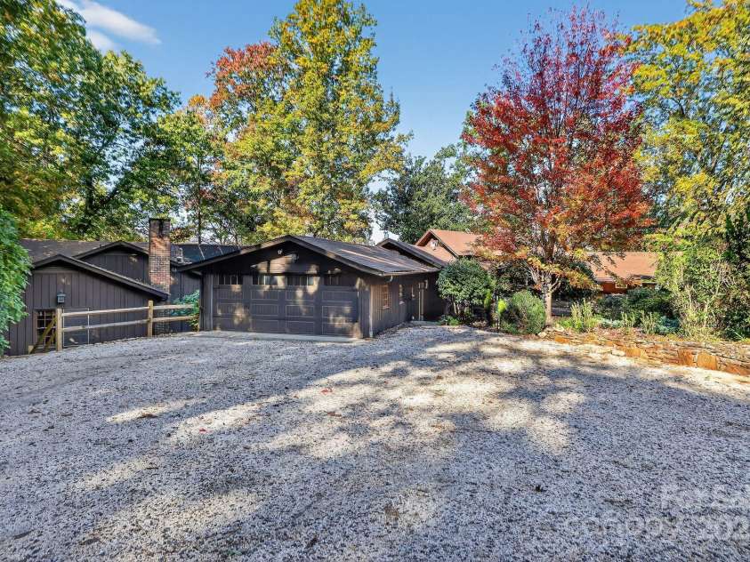 777 River Road, Tryon, NC 28782.  MLS# CAR4316725, YatesRealty ID 6286. Drone - Primary House Front