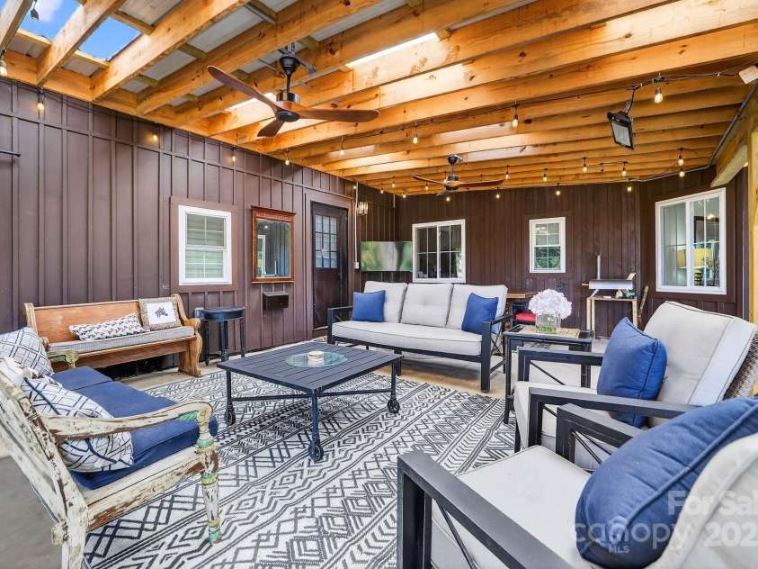 777 River Road, Tryon, NC 28782.  MLS# CAR4316725, YatesRealty ID 6286. Primary House Patio