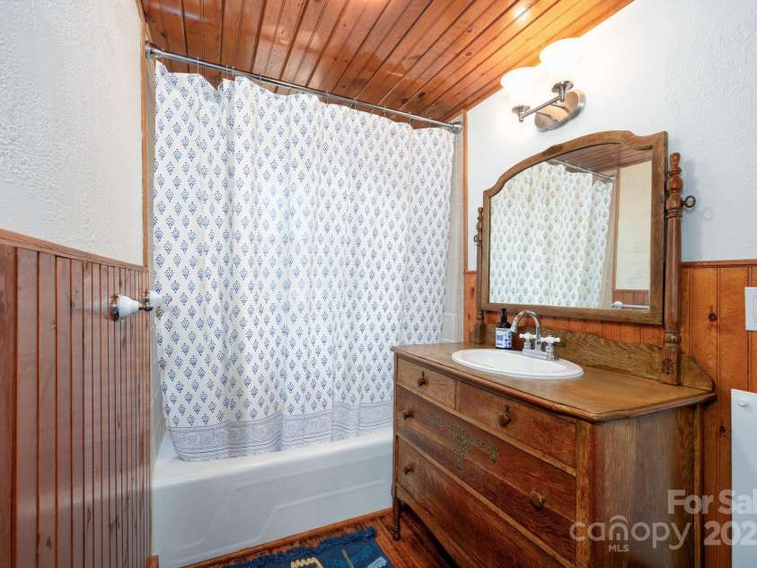 1022 Phipps Creek Road, Burnsville, NC 28714.  MLS# CAR4235645, YatesRealty ID 6287. Charming Antique vanity in Guest Bath