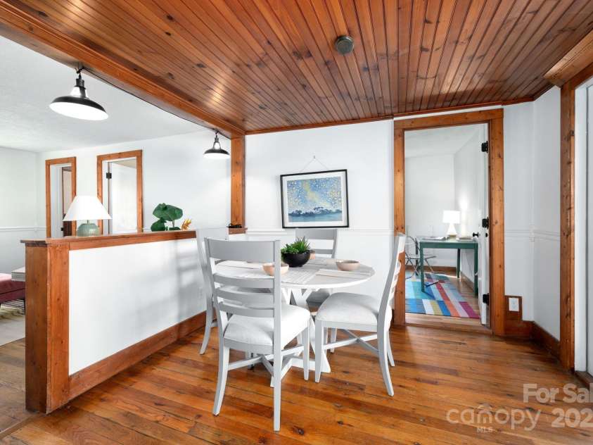 1022 Phipps Creek Road, Burnsville, NC 28714.  MLS# CAR4235645, YatesRealty ID 6287. Cozy Dining Area Off Kitchen with Back Deck Access