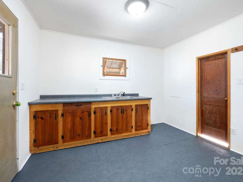 1022 Phipps Creek Road, Burnsville, NC 28714.  MLS# CAR4235645, YatesRealty ID 6287. Outbuilding makes great art studio or office no water currently