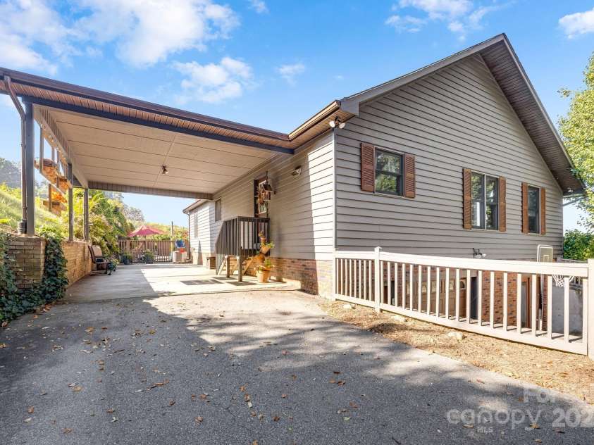 57 Stillwater Springs Road, Burnsville, NC 28714.  MLS# CAR4295423, YatesRealty ID 629. Attached carport 57 Stillwater Springs Road Burnsville, NC