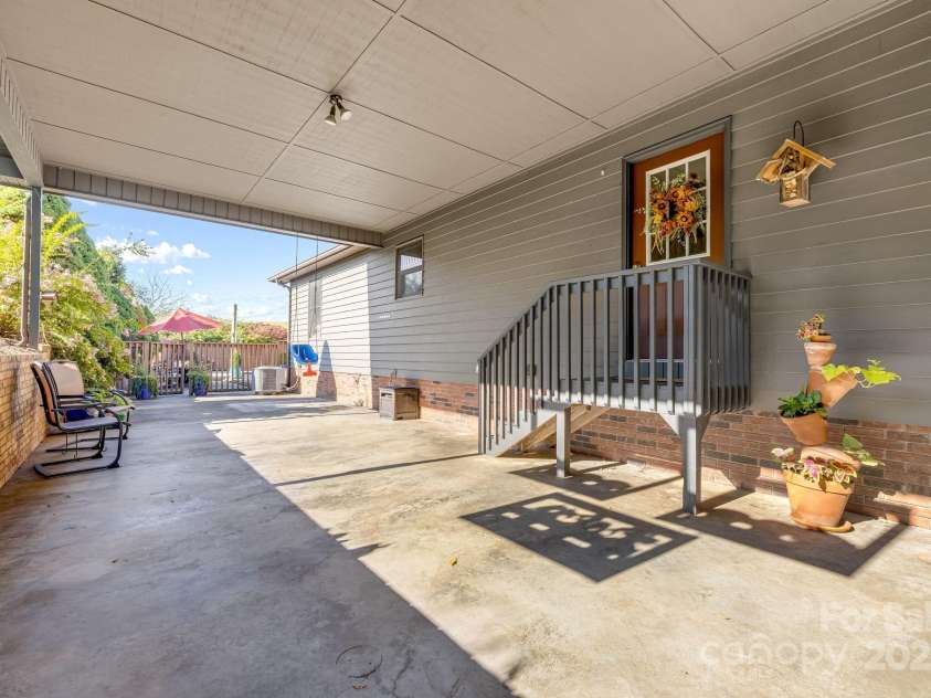 57 Stillwater Springs Road, Burnsville, NC 28714.  MLS# CAR4295423, YatesRealty ID 629. Attached carport 57 Stillwater Springs Road Burnsville, NC