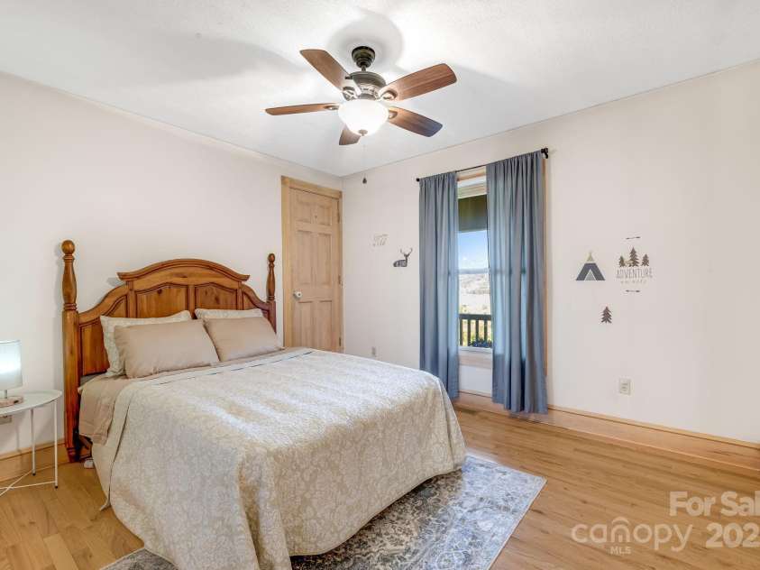 57 Stillwater Springs Road, Burnsville, NC 28714.  MLS# CAR4295423, YatesRealty ID 629. Bedroom 57 Stillwater Springs Road Burnsville, NC