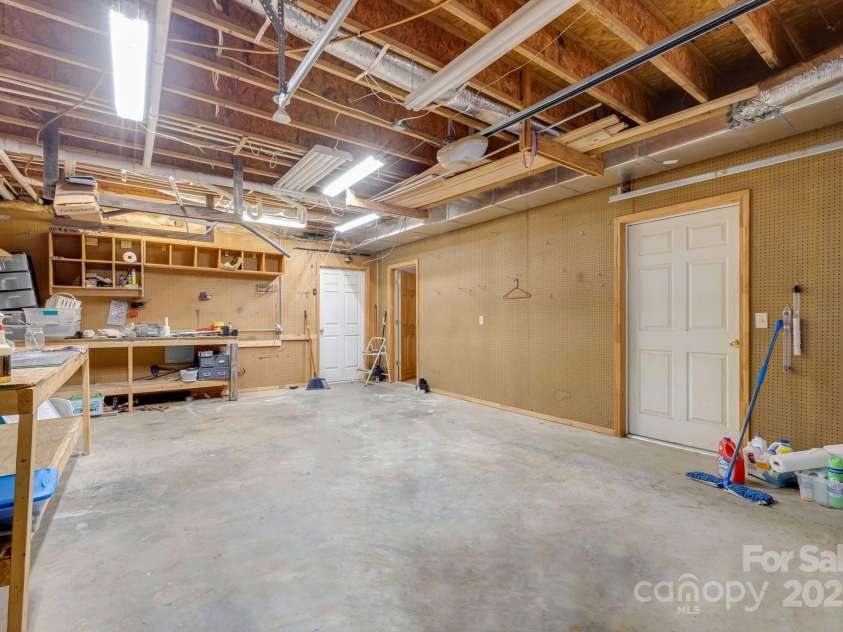 57 Stillwater Springs Road, Burnsville, NC 28714.  MLS# CAR4295423, YatesRealty ID 629. Garage 57 Stillwater Springs Road Burnsville, NC