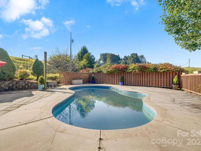 57 Stillwater Springs Road, Burnsville, NC 28714.  MLS# CAR4295423, YatesRealty ID 629. In ground pool and patio 57 Stillwater Springs Road Burnsville, NC