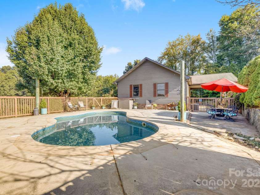 57 Stillwater Springs Road, Burnsville, NC 28714.  MLS# CAR4295423, YatesRealty ID 629. In ground pool and patio 57 Stillwater Springs Road Burnsville, NC