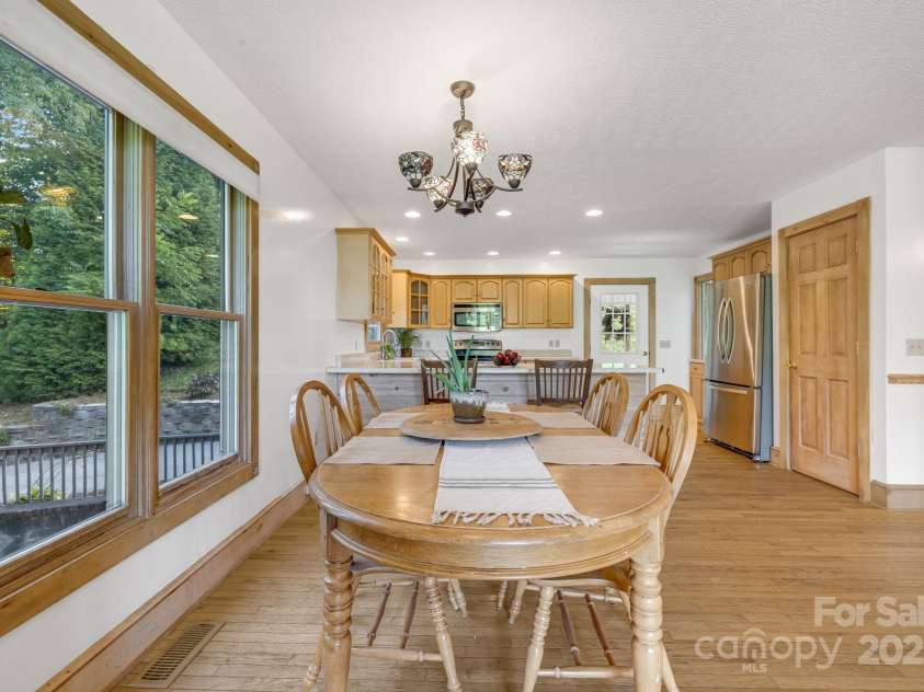 57 Stillwater Springs Road, Burnsville, NC 28714.  MLS# CAR4295423, YatesRealty ID 629. Kitchen and Dining  57 Stillwater Springs Road Burnsville, NC