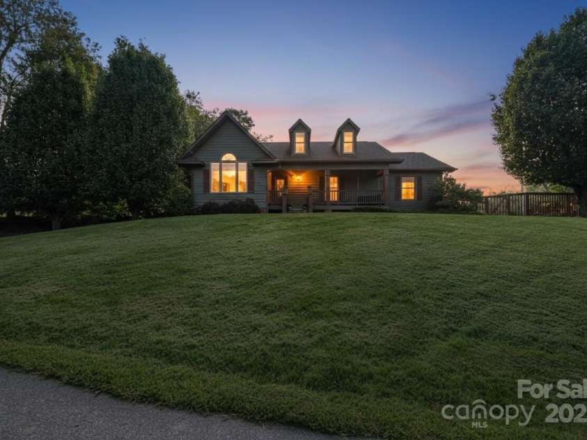 57 Stillwater Springs Road, Burnsville, NC 28714.  MLS# CAR4295423, YatesRealty ID 629. Twilight 57 Stillwater Springs Road Burnsville, NC