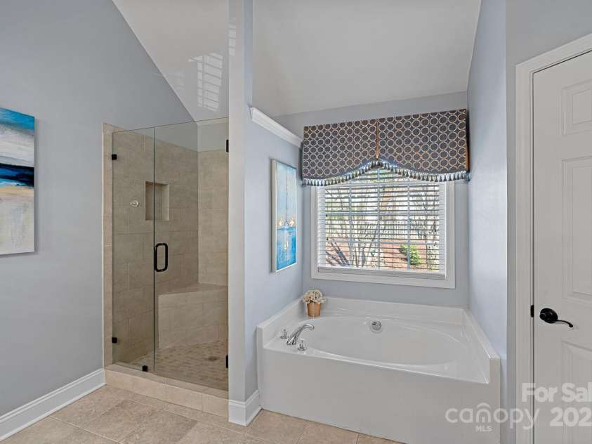 114 Runningdeer Drive, Mooresville, NC 28117.  MLS# CAR4231864, YatesRealty ID 6297. Garden Tub and Frameless glass shower