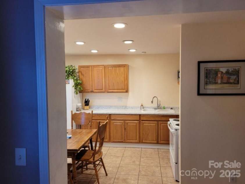 6051 Pointe West Lane, Vale, NC 28168.  MLS# CAR4092329, YatesRealty ID 63. Entryway leading into newly renovated kitchen