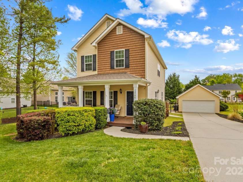 12746 Bravington Road, Huntersville, NC 28078.  MLS# CAR4245023, YatesRealty ID 6302. Enjoy your covered front porch and two-car detached garage.