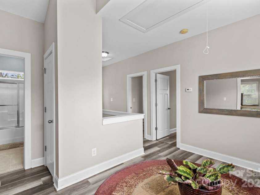 12746 Bravington Road, Huntersville, NC 28078.  MLS# CAR4245023, YatesRealty ID 6302. Entranceways to the third full bath and 3rd and 4th bedrooms.