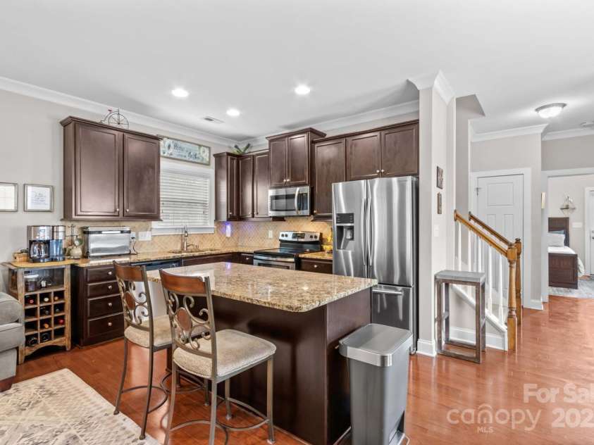 12746 Bravington Road, Huntersville, NC 28078.  MLS# CAR4245023, YatesRealty ID 6302. Large kitchen island and stainless steel appliances.