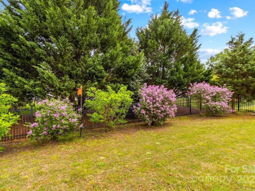 12746 Bravington Road, Huntersville, NC 28078.  MLS# CAR4245023, YatesRealty ID 6302. Lilacs are in full bloom.