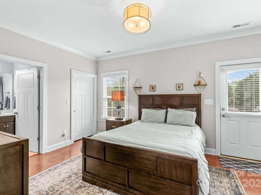12746 Bravington Road, Huntersville, NC 28078.  MLS# CAR4245023, YatesRealty ID 6302. The second primary bedroom is on the main floor, with a full bath and a walk-in closet.