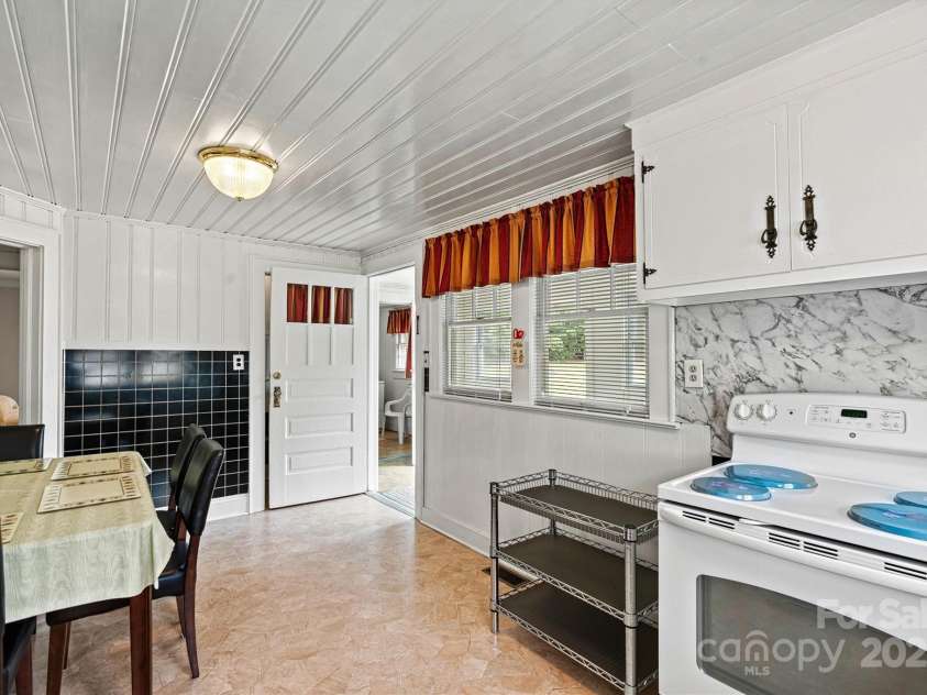 128 10th Street, Hildebran, NC 28637.  MLS# CAR4184496, YatesRealty ID 6303. Kitchen and Breakfast Area/Back Entry View
