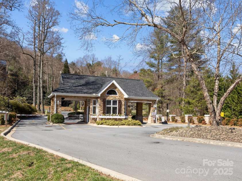 43 Golden Pond Way, Hendersonville, NC 28791.  MLS# CAR4234066, YatesRealty ID 6305. Manned gate station as one drives in from Brevard Rd.