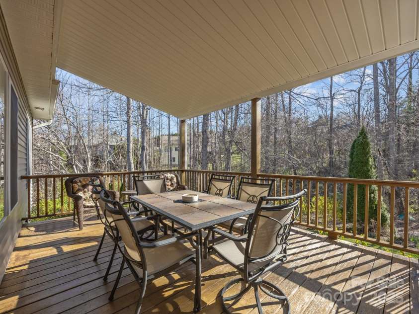 43 Golden Pond Way, Hendersonville, NC 28791.  MLS# CAR4234066, YatesRealty ID 6305. Relax on the covered back deck overlooking the private back yard.