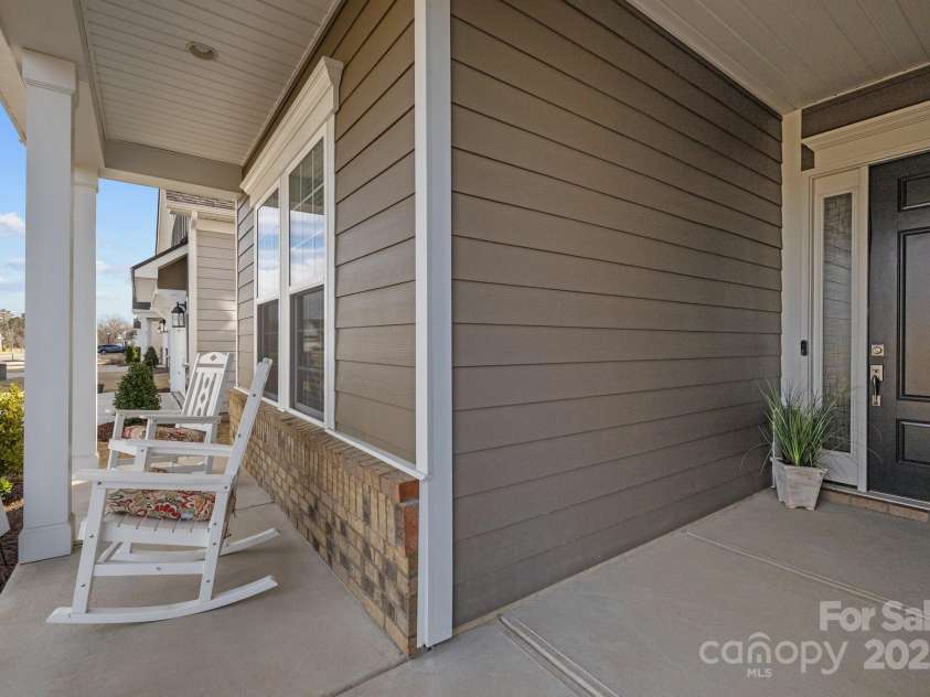 240 Portrait Way, Indian Trail, NC 28079.  MLS# CAR4218227, YatesRealty ID 6312. Rocking chair front porch