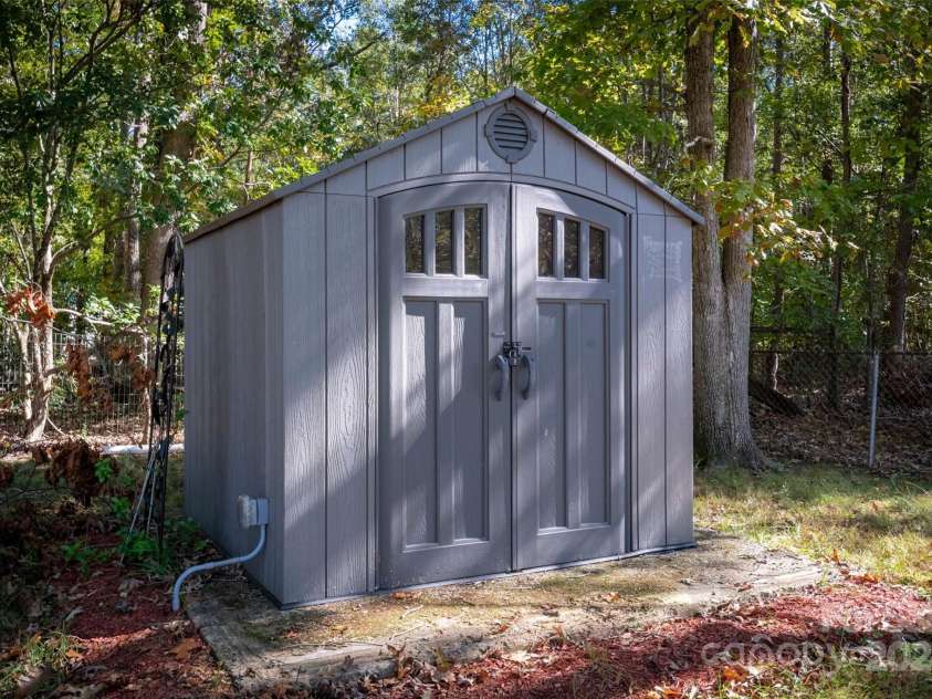 4108 Scarlet Street, Matthews, NC 28104.  MLS# CAR4194045, YatesRealty ID 6316. Shed in backyard