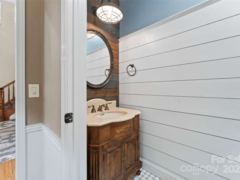 2720 Lentz Road, China Grove, NC 28023.  MLS# CAR4190488, YatesRealty ID 6325. Beautiful half bath with shiplap walls and tile flooring.