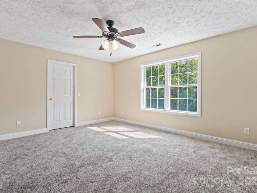 2720 Lentz Road, China Grove, NC 28023.  MLS# CAR4309058, YatesRealty ID 6325. Upstairs Guest Bedroom 2 has a walk-in closet