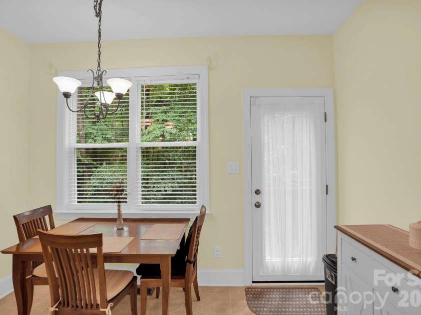 9601 Twin Falls Court, Mint Hill, NC 28227.  MLS# CAR4358686, YatesRealty ID 6328. Breakfast Nook opens to deck