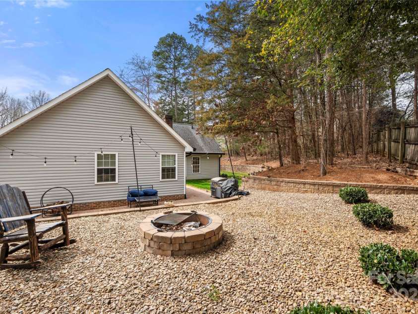 7219 Morningdew Court, Denver, NC 28037.  MLS# CAR4233795, YatesRealty ID 6333. Great fire pit are for sitting and enjoying