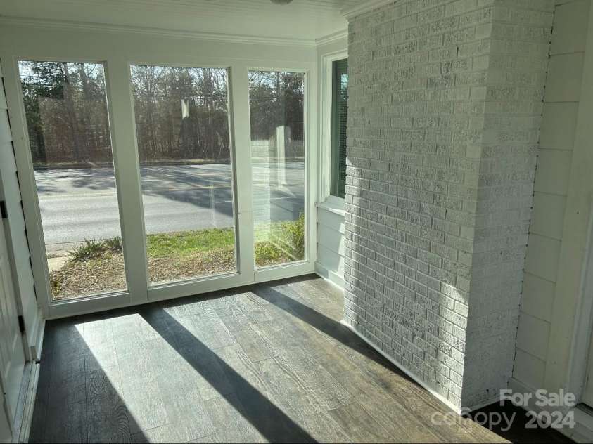 37722 US 52 Highway, New London, NC 28127.  MLS# CAR4195462, YatesRealty ID 6337. Sunroom off carport - enters living room