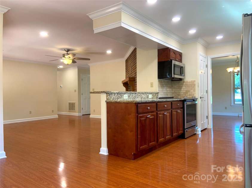 211 Worthington Street, Shelby, NC 28150.  MLS# CAR4243112, YatesRealty ID 6346. Kitchen and Family Room