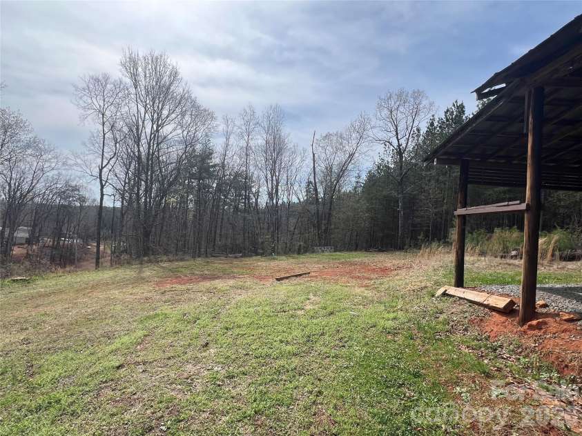 365 Hillbilly Lane, Mill Spring, NC 28756.  MLS# CAR4359500, YatesRealty ID 6349. View from detached garage to another potential build site.