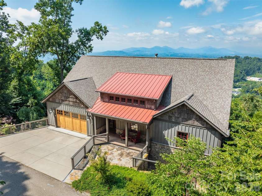 9 Soaring Hawk View, Asheville, NC 28804.  MLS# CAR4351587, YatesRealty ID 6354. House view to the west / sunset from back decks