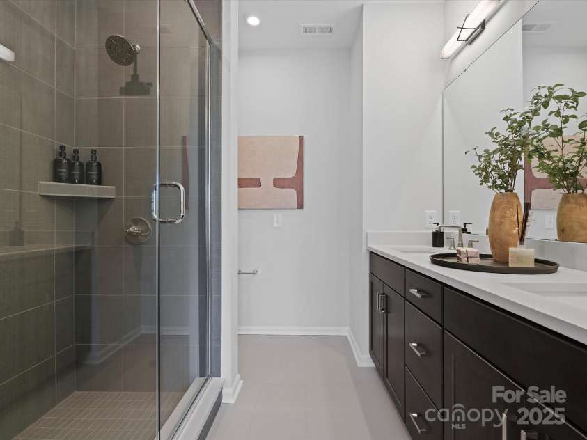5032 Beirut Drive, Charlotte, NC 28217.  MLS# CAR4330424, YatesRealty ID 6362. Primary Bath with Modern Tiled Walk-In Shower.