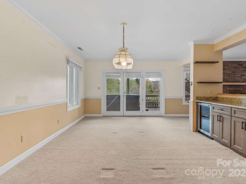 6 Valley Drive, Weaverville, NC 28787.  MLS# CAR4246234, YatesRealty ID 6369. Downstairs common area