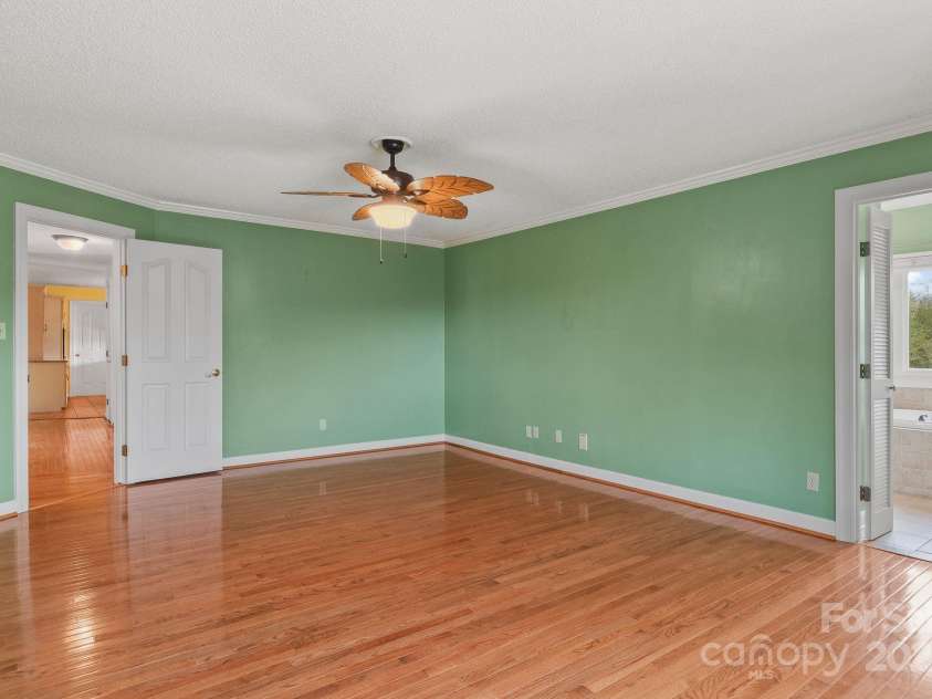 6 Valley Drive, Weaverville, NC 28787.  MLS# CAR4246234, YatesRealty ID 6369. Primary bedroom on main level with en suite large bathroom.