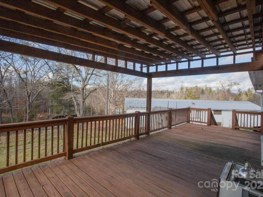 9 Eller Ford Road, Weaverville, NC 28787.  MLS# CAR4203004, YatesRealty ID 6373. 32x12 back deck off singlewide