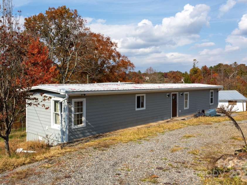 9 Eller Ford Road, Weaverville, NC 28787.  MLS# CAR4203004, YatesRealty ID 6373. 65x14 Singlewide used as office space