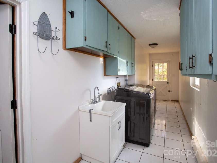 9 Eller Ford Road, Weaverville, NC 28787.  MLS# CAR4203004, YatesRealty ID 6373. Large laundry room