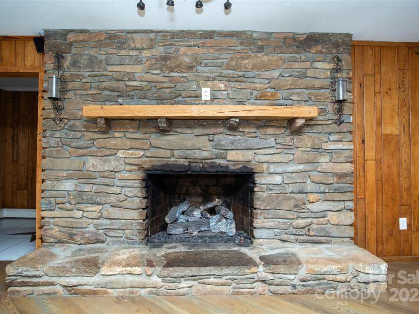 9 Eller Ford Road, Weaverville, NC 28787.  MLS# CAR4203004, YatesRealty ID 6373. Upstairs Fireplace