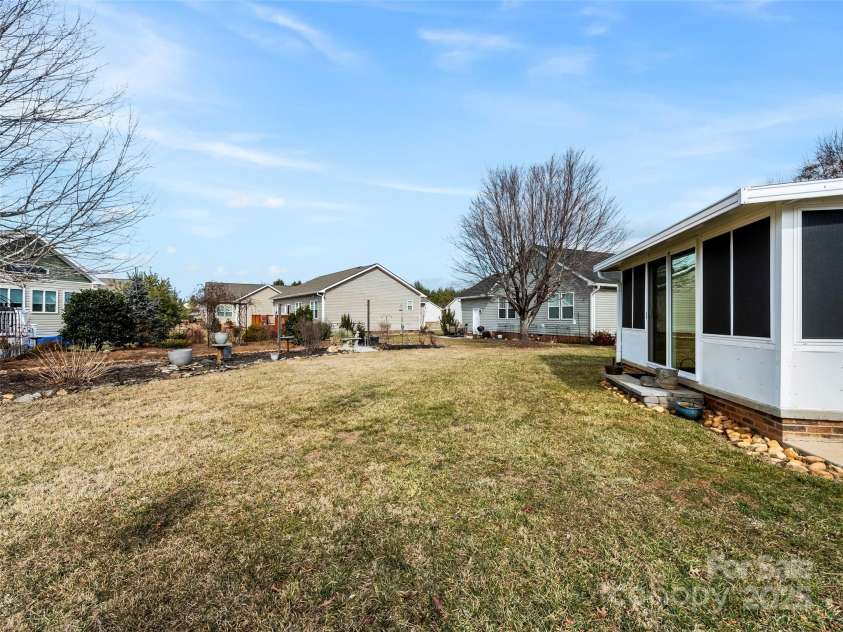 449 Riverwind Drive, Hendersonville, NC 28739.  MLS# CAR4220868, YatesRealty ID 6376. Backyard and Garden Area