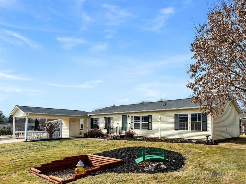 449 Riverwind Drive, Hendersonville, NC 28739.  MLS# CAR4220868, YatesRealty ID 6376. Front view of Home