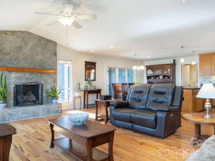 344 Hague Drive, Columbus, NC 28722.  MLS# CAR4350359, YatesRealty ID 6377. Living area with stone fireplace (propane)