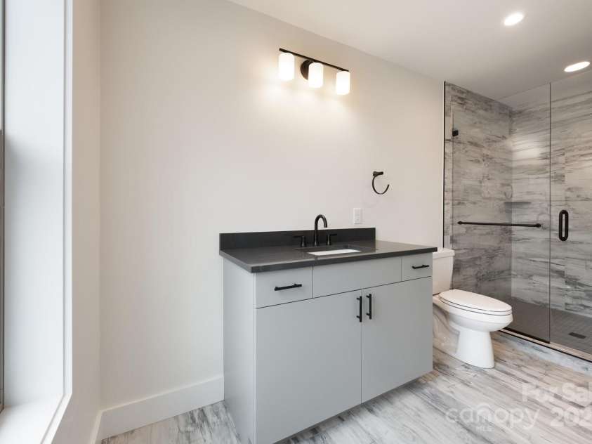 13 Crestfield Avenue, Woodfin, NC 28804.  MLS# CAR4222543, YatesRealty ID 6380. Upstairs Ensuite Bathroom