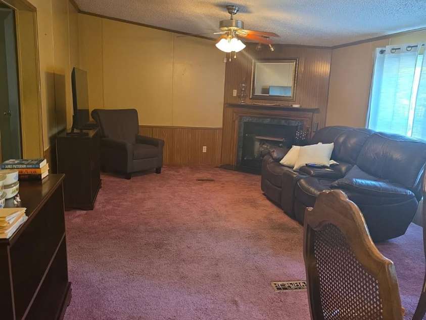 927 Miles Road, Jefferson, SC 29718.  MLS# CAR4247335, YatesRealty ID 6385. Den looking from dining area