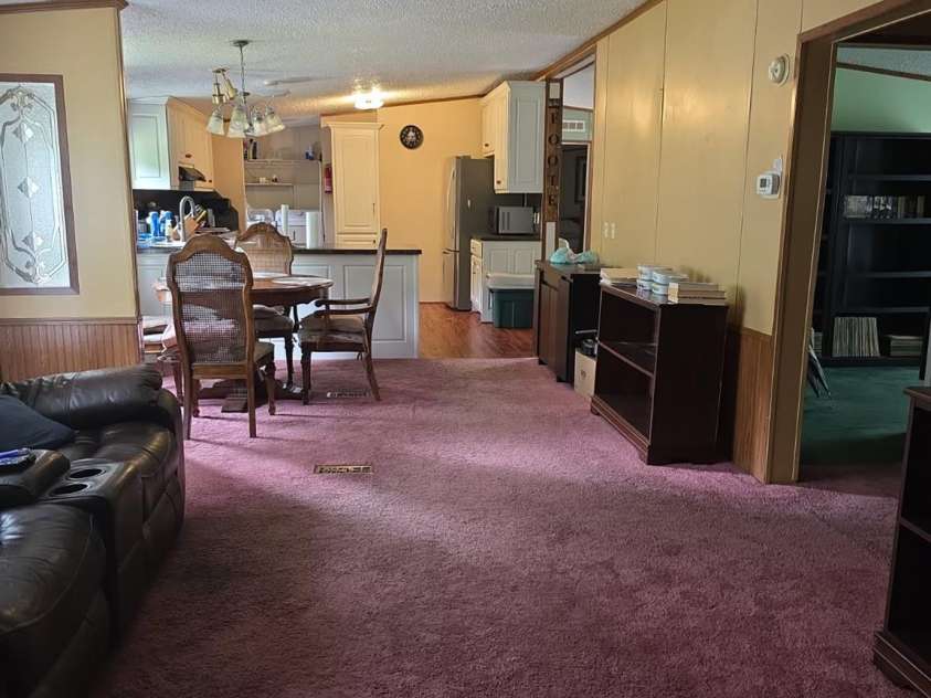 927 Miles Road, Jefferson, SC 29718.  MLS# CAR4247335, YatesRealty ID 6385. Den looking towards dining area and kitchen