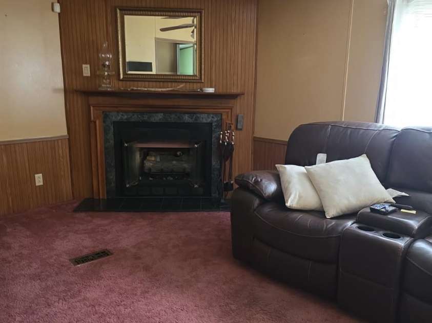 927 Miles Road, Jefferson, SC 29718.  MLS# CAR4247335, YatesRealty ID 6385. Den with fireplace/gas logs