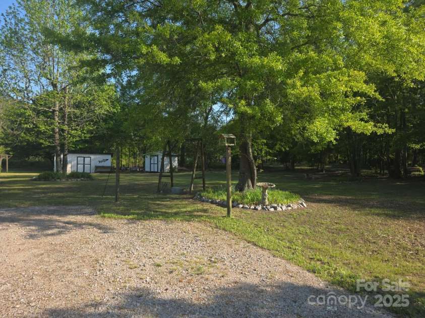 927 Miles Road, Jefferson, SC 29718.  MLS# CAR4247335, YatesRealty ID 6385. Spacious side yard