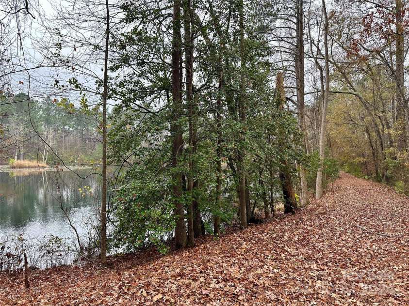 4108 Johnson Road, Jefferson, SC 29718.  MLS# CAR4206272, YatesRealty ID 6386. Pathway over the pond dam