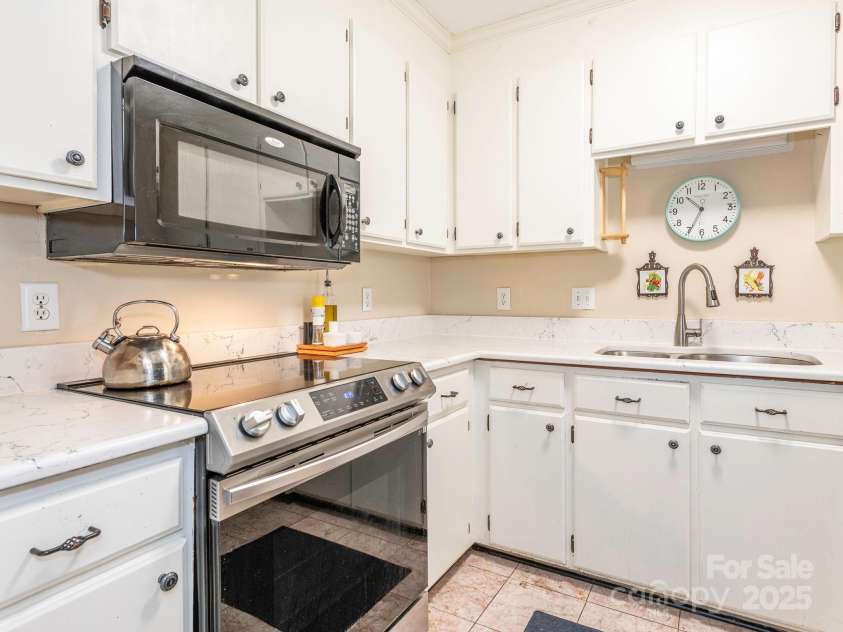 1022 Kenilworth Court, Concord, NC 28027.  MLS# CAR4243363, YatesRealty ID 6397. Kitchen updated with lovely quartz counters & white cabinets